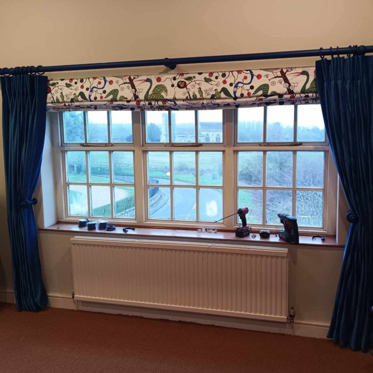 Made to measure roman blind Made to measure Roman blind fitted in a living room for a soft, elegant window finish