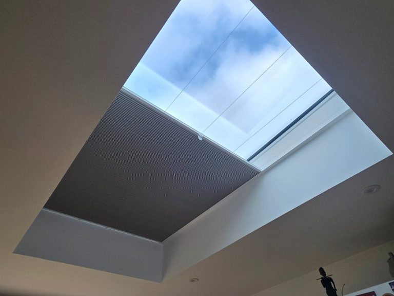 Roof lantern blind installation Made to measure roof lantern blind installed to help manage glare, heat and privacy in a glazed extension