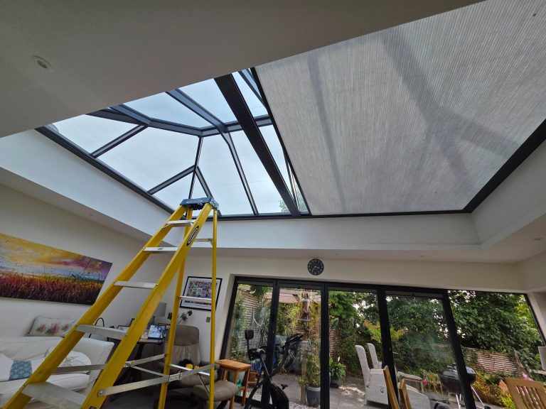 Motorised Roof Lantern Blind Repair | TrueShade Interiors Motorised roof lantern blind undergoing fault diagnosis and repair, with an access ladder positioned beneath the large roof lantern