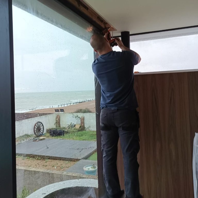 Custom motorised blackout blind installation Specialist installation of a custom motorised full blackout blind, carefully measured and fitted for a precise finish