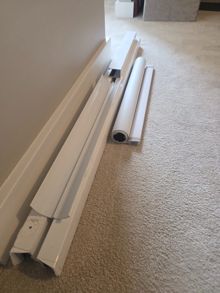 Blackout blind repair parts Motorised blackout blind components carefully removed during repair and replacement work
