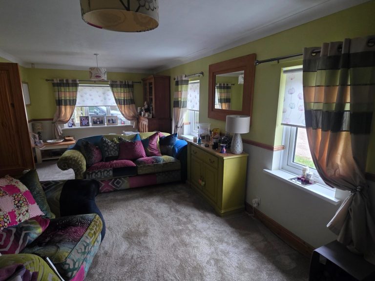 Five motorised blinds in living room Five made to measure motorised blinds installed across multiple living room windows for easy remote control and a clean, uniform finish
