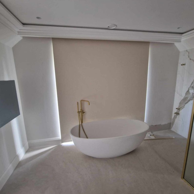 Bathroom blackout roller blind installation Made to measure blackout roller blind installed in a modern bathroom by TrueShade Interiors